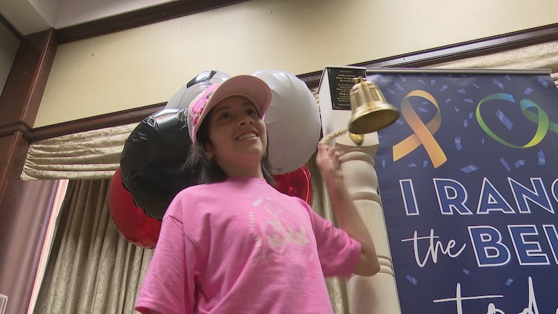 Surrounded by family and friends, Cat Carrasco rang the bell at UMC Children's Hospital...