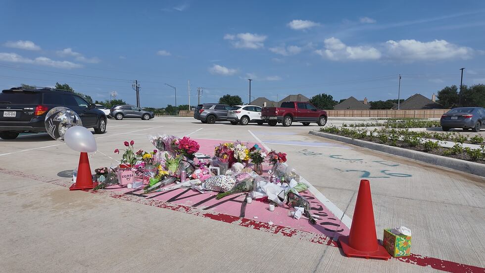 A memorial has been set up in the parking lot of IL Texas Aggieland High School in College...