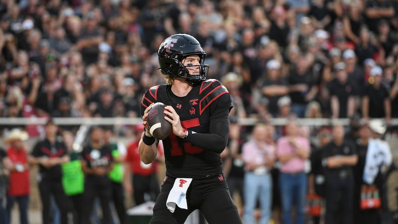 Texas Tech quarterback Will Hammond drops back to throw the ball against Houston during the...