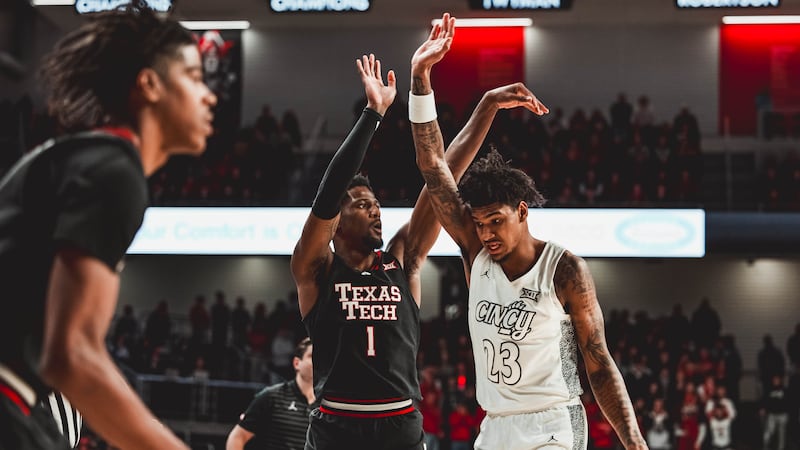 Texas Tech basketball's Kevin Overton takes a shot against Cincinnati.
